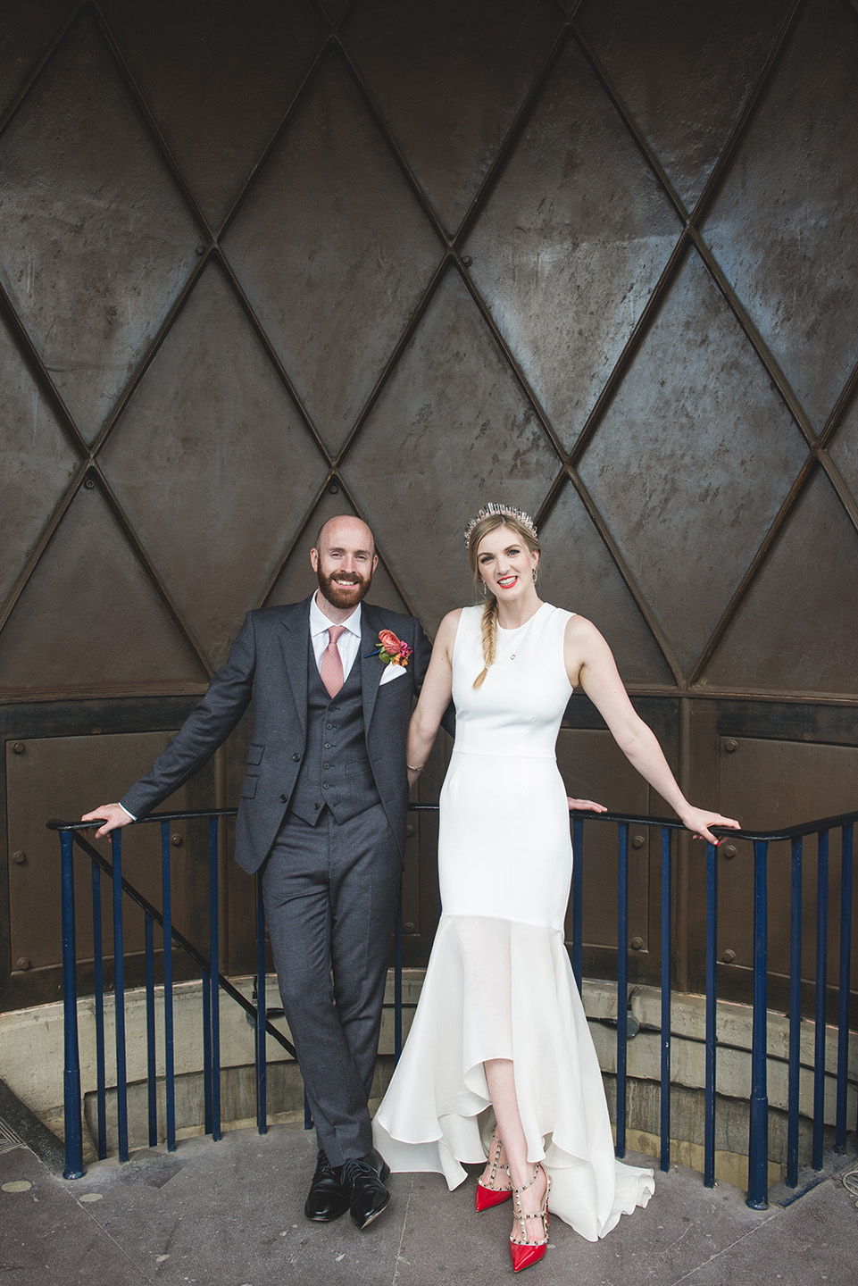 Sleek wedding portrait of bride and groom at a city wedding at Trinity Buoy Wharf in London by UK wedding photographer byGarazi