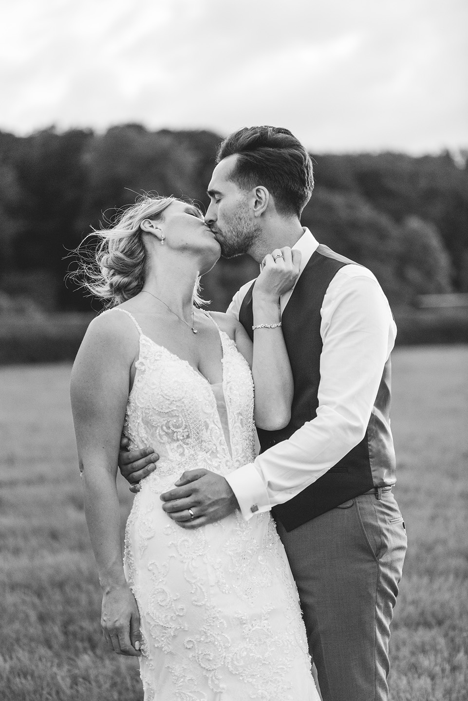 Romantic black and white portrait of a bride and groom in a field festival tipi wedding in the West Midlands by Birmingham Wedding Photographers byGarazi