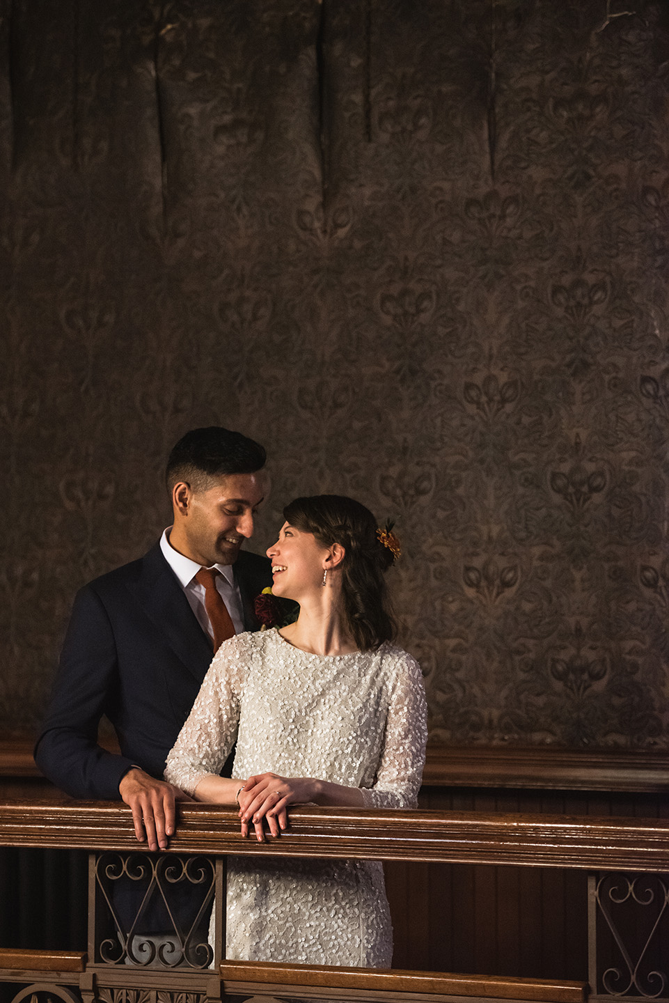 Bride and groom smiling at each other at Asian wedding in Highbury Hall by Birmingham Wedding Photography byGarazi