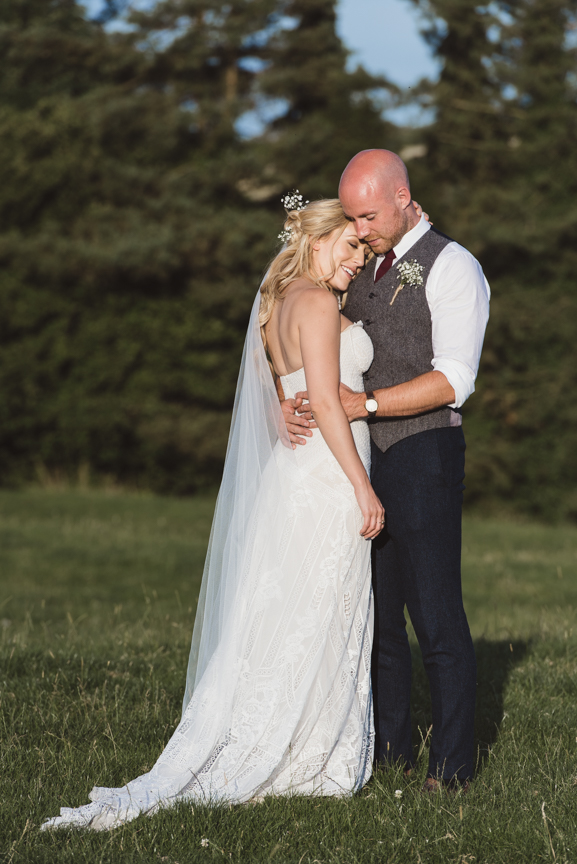 romantic outdoor portrait of bride and groom at Kingscote Wedding Barn by West Midlands Wedding Photographer byGarazi