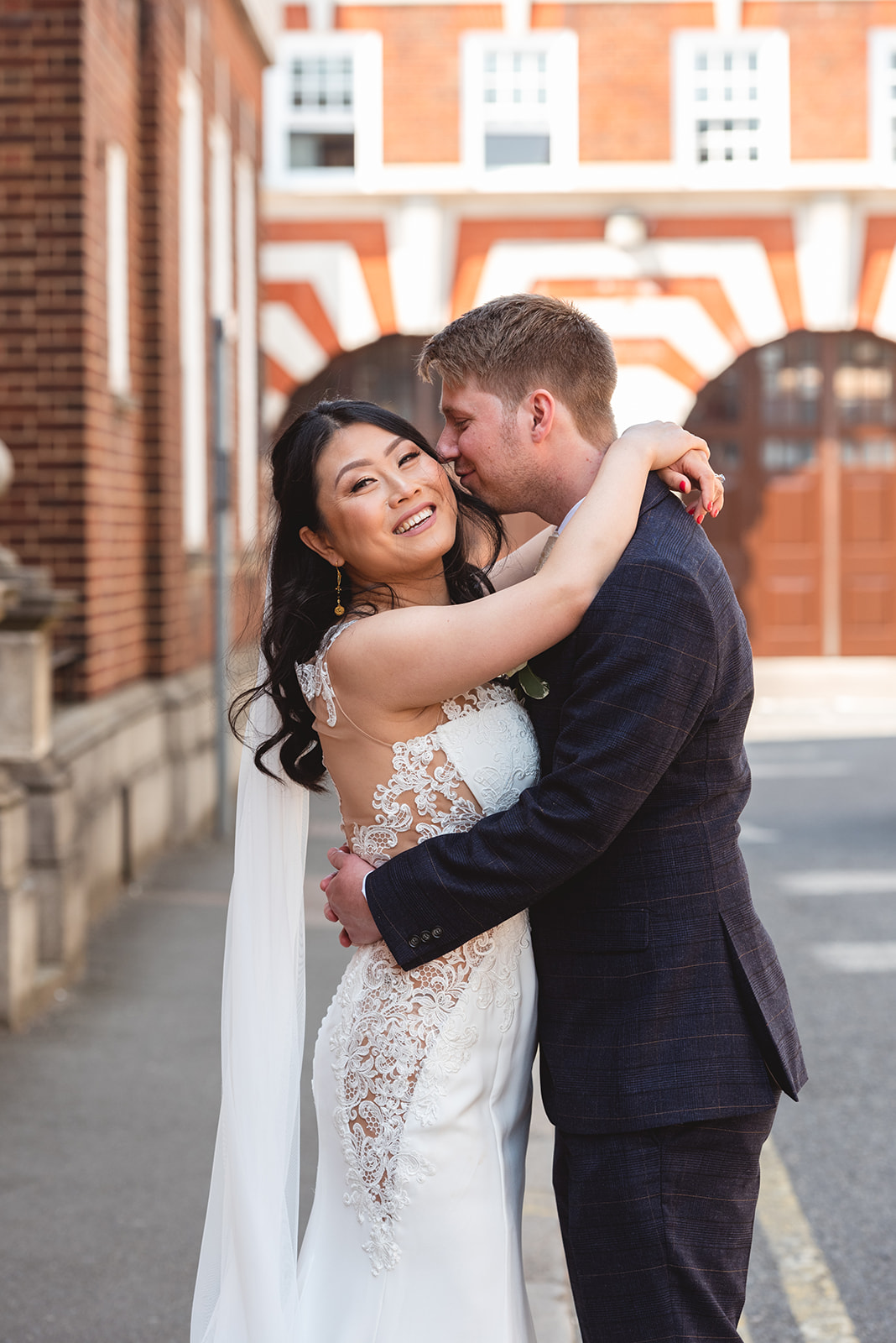 loving couple portrait in a city pub wedding by female Birmingham Wedding Photographer byGarazi